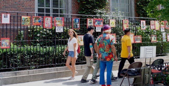 A man sold paintings on a nearby sidewalk. 